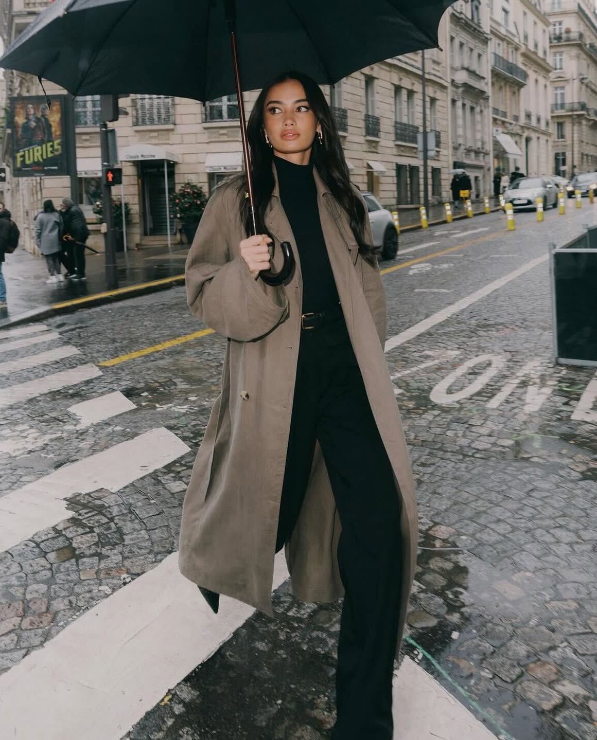 Woman wearing a rainy-day outfit.