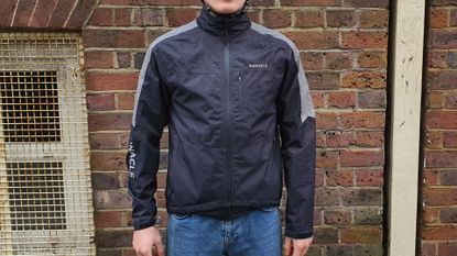 Image shows a rider wearing the Pinnacle Competition cycling jacket