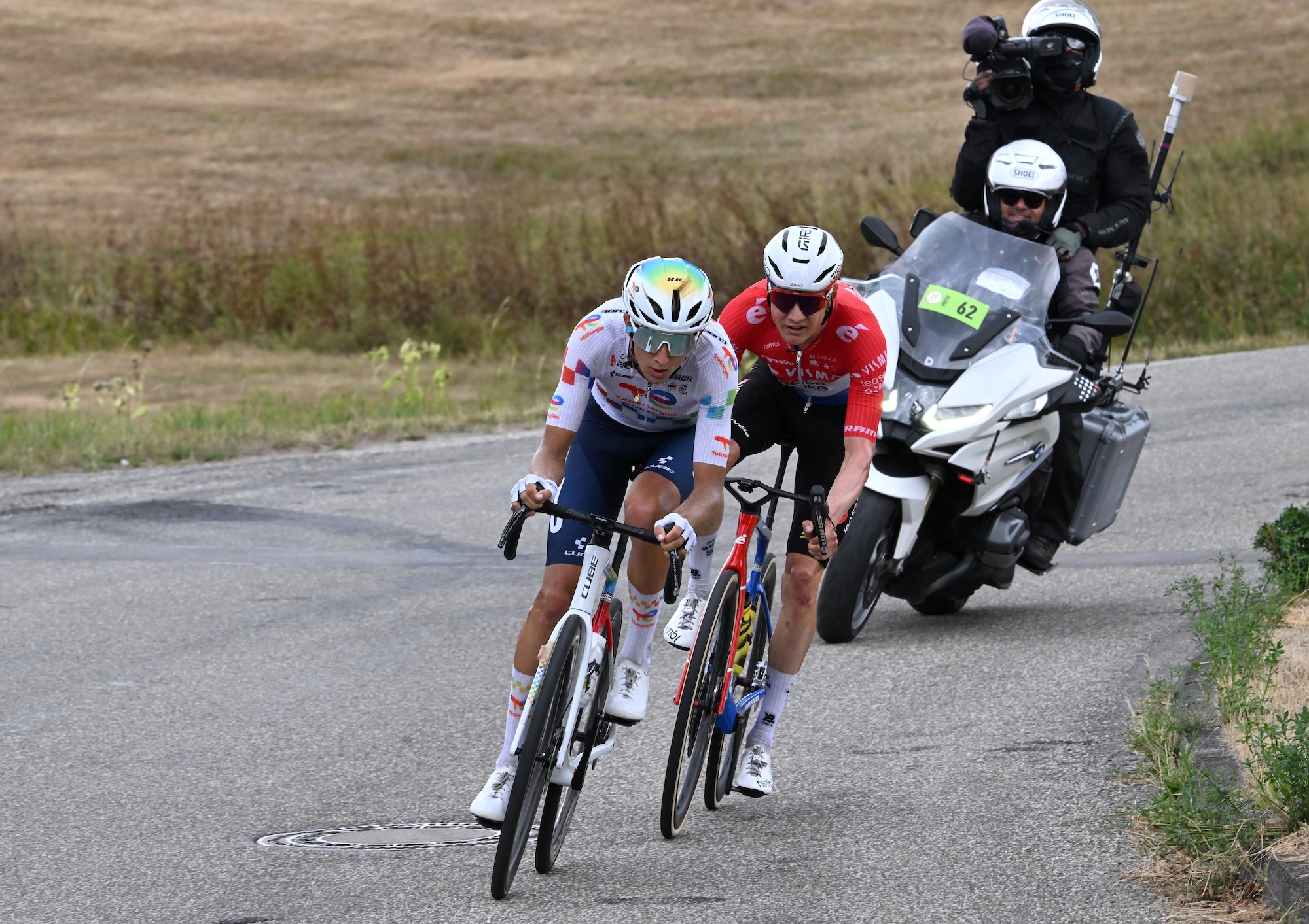 (L-R) Theo Hebert of France and Team TotalEnergies and Wilco Kelderman of Netherlands and Team Visma | Lease a Bike compete in the breakaway