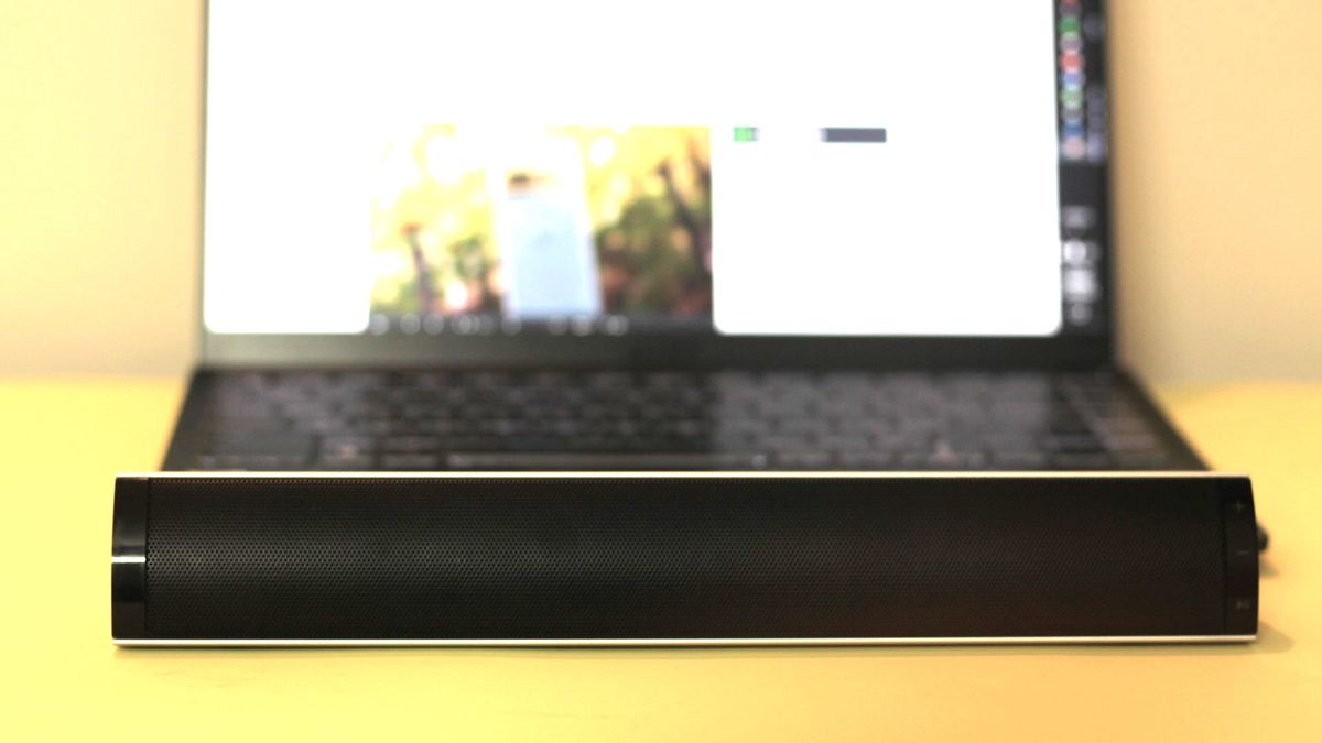 Edifier MF200 soundbar on a flat yellow surface