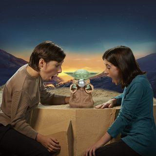 Hasbro's new Galactic Snackin' Grogu lets you feed Baby Yoda and help him use the Force. Available in Fall 2021 for $79.99.