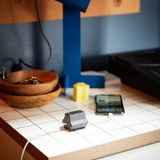 IKEA HAVSKÅL USB anchors on a tiled desk with a blue lamp