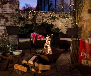 A fire pit on a patio in winter