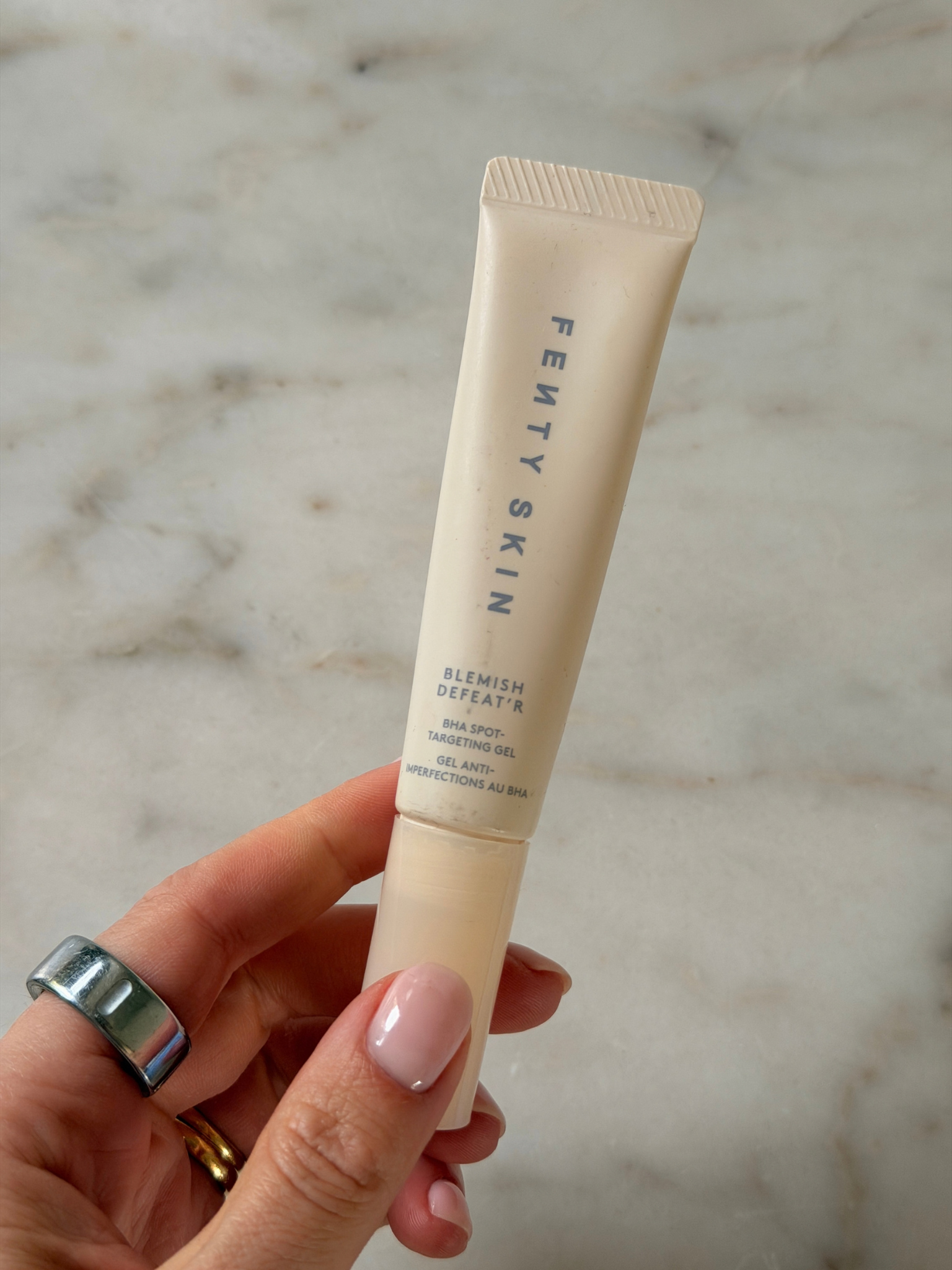 Freelance beauty editor Grace Day holding the Fenty Skin spot treatment