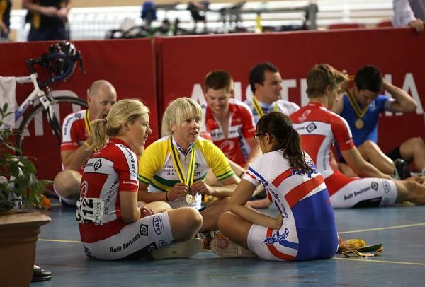 The winners of the keirin sit and chat after the podium ceremony.