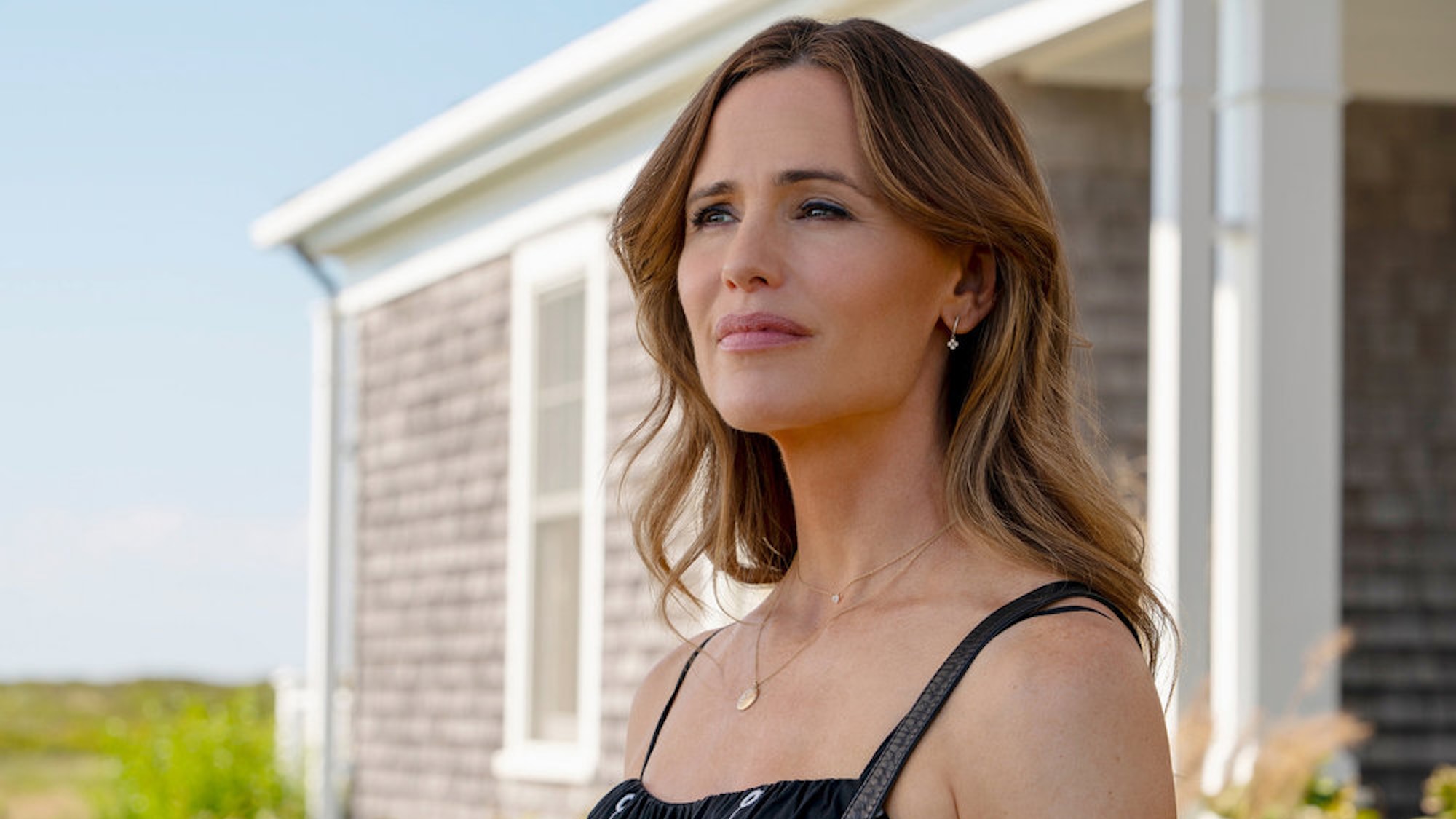 Jennifer Garner standing outside smiling in The Five Star Weekend