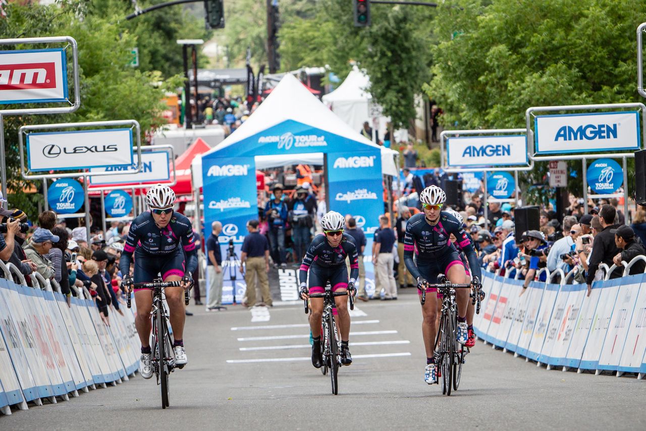 Bepink ride past the crowd on course