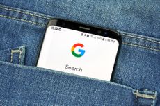 Google search on a smartphone poking out of a pocket