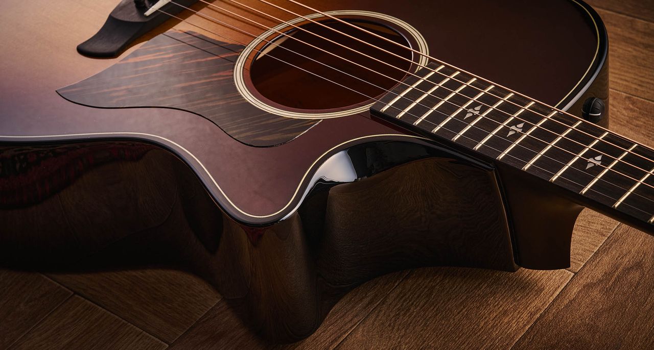 Taylor Builder&rsquo;s Edition 514ce Kona Burst pictured against a wooden floor and patterned rug.