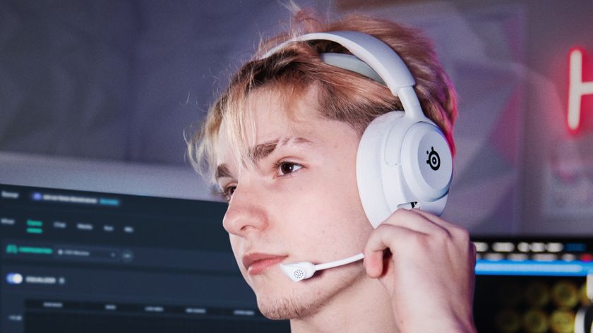 SteelSeries Arctis Nova 5 in white being worn by a gamer