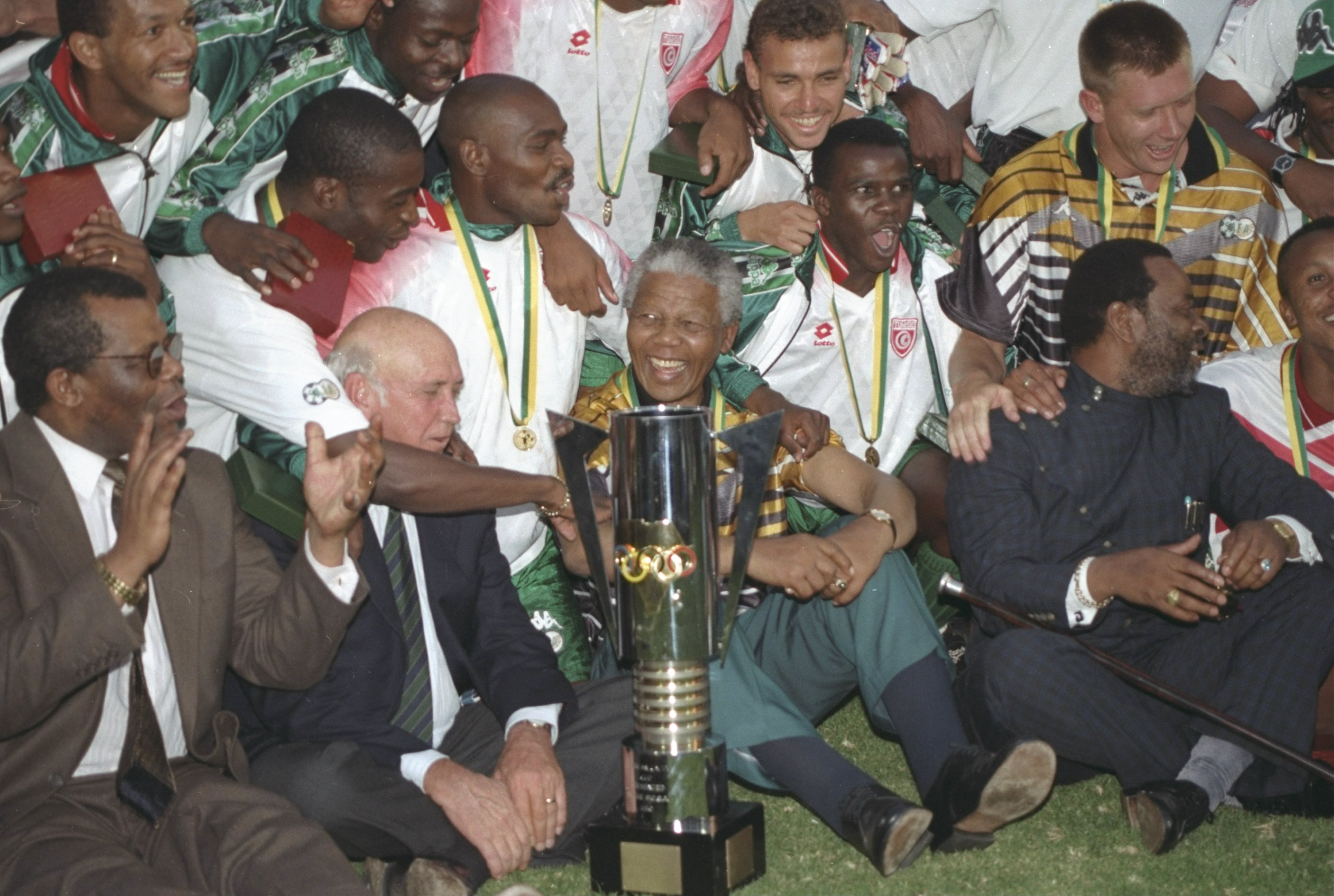 Nelson Mandela celebrates with the South Africa players after their Africa Cup of Nations win in February 1996.