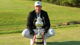 Dean Burmester with the Investec South African Open Championship trophy