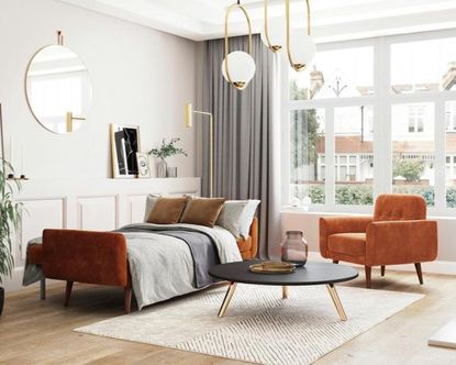 An orange velvet sofa bed extended in a modern living room