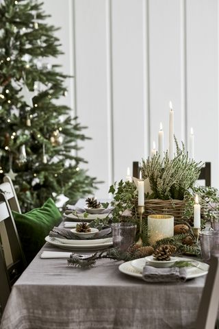 rustic Christmas table centrpiece in wicker basket and candles by Neptune