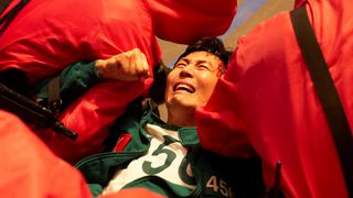 Gi-hun is pulled down by guards in Squid Game season 3