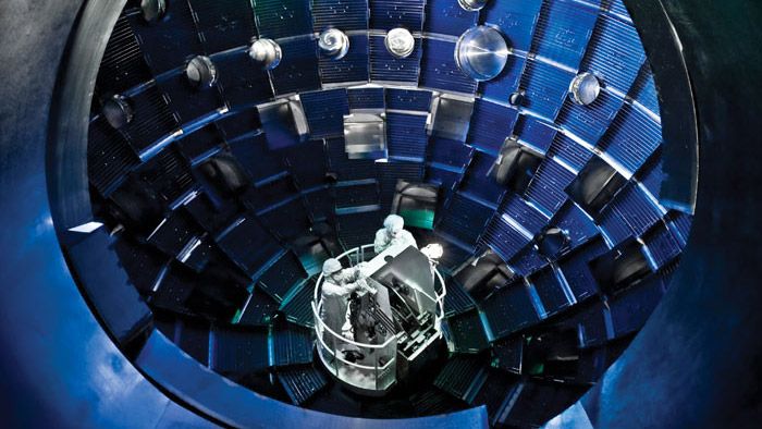 Technicians servicing the target chamber