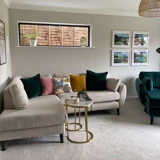 living room with beige sofa, colourful cushions and green snuggler armchair