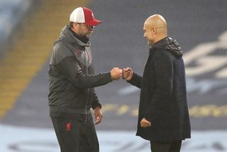 Liverpool manager Jurgen Klopp (left) and Manchester City manager Pep Guardiola after the final whistle during the Premier League match at the Etihad Stadium, Manchester