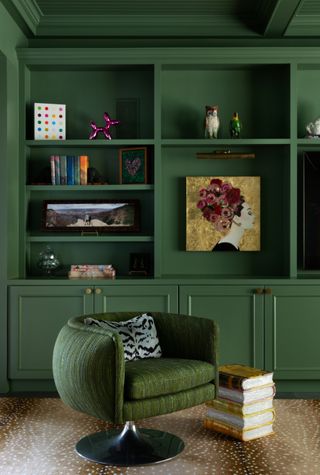 A green room with matching olive green chair