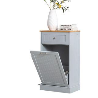 A kitchen trash can with tilt mechanism