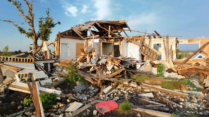 picture of a house destroyed by a tornado