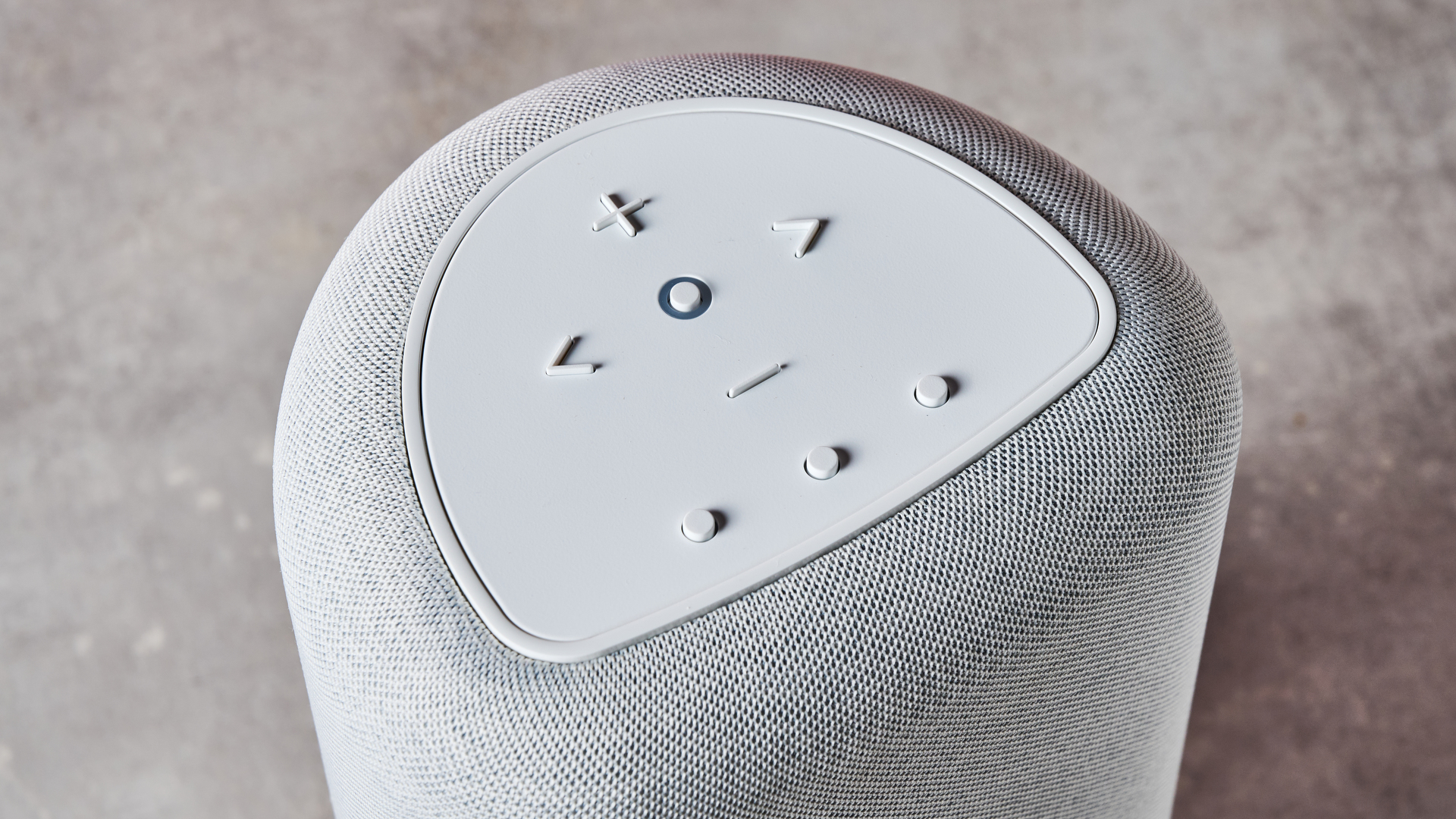 A closeup of the top of the Bluesound Pulse Flex, showing its play / pause, skip, volume and preset buttons.