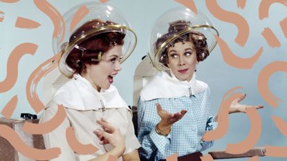 two women using hair dryer hoods vintage