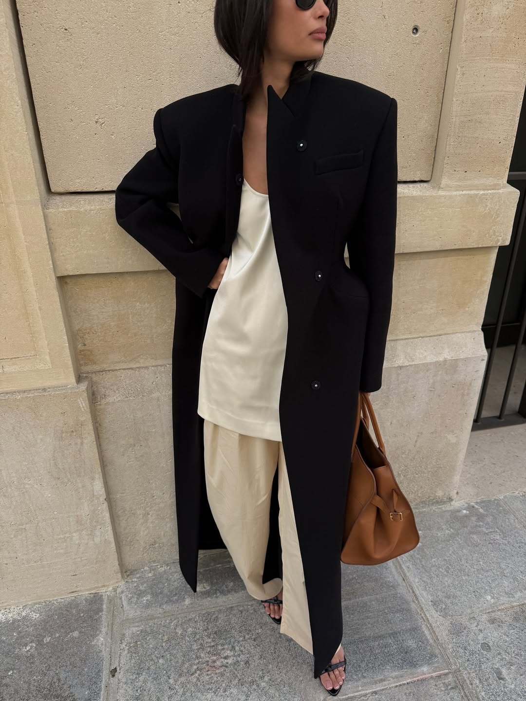 Kelsey Merritt wearing a blazer coat with the collar upturned