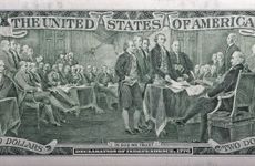 A depiction of the signing of Declaration of Independence on a dollar bill.