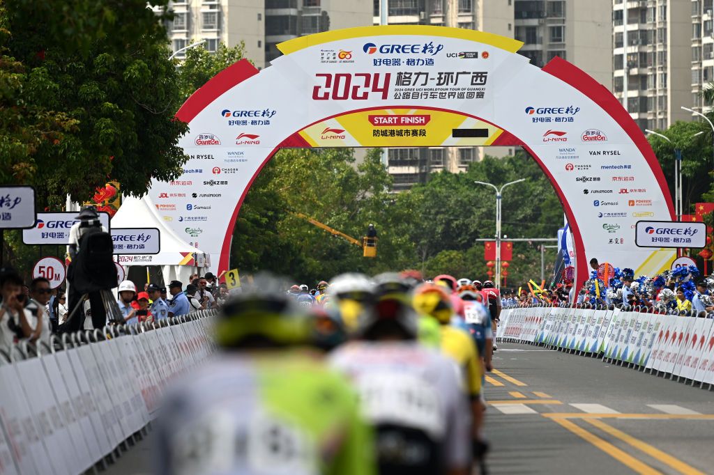 FANGCHENGGANG CHINA OCTOBER 15 A general view of the peloton passing the finish line area during the 5th GreeTour Of Guangxi 2024 Stage 1 a 1493km stage from Fangchenggang to Fangchenggang UCIWT on October 15 2024 in Fangchenggang China Photo by Dario BelingheriGetty Images