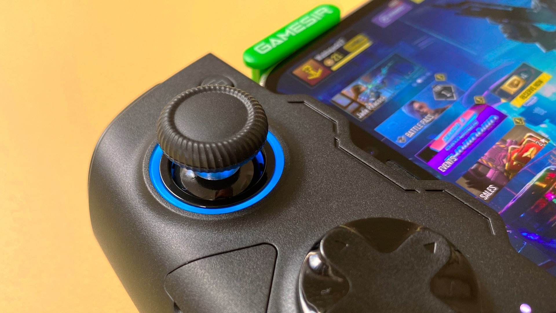 The GameSir X4 Aileron iOS games controller against a yellow background.