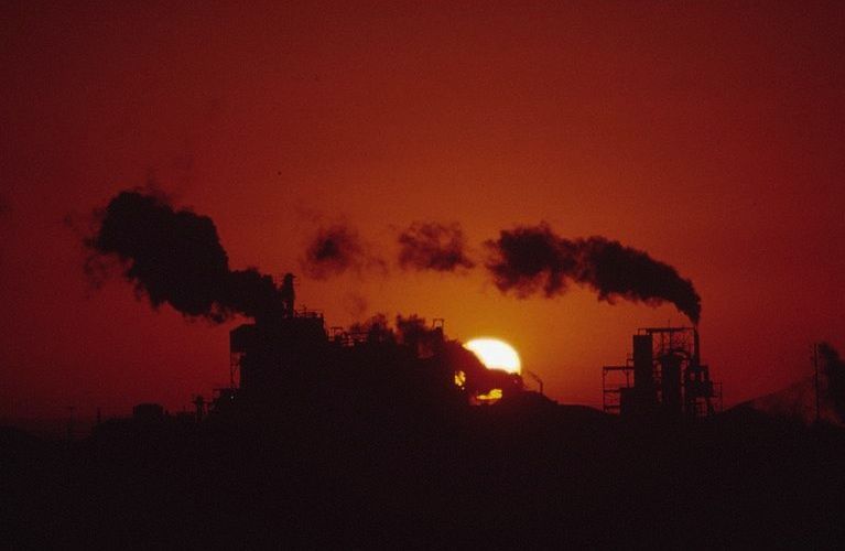 Setting Sun and Smokestacks