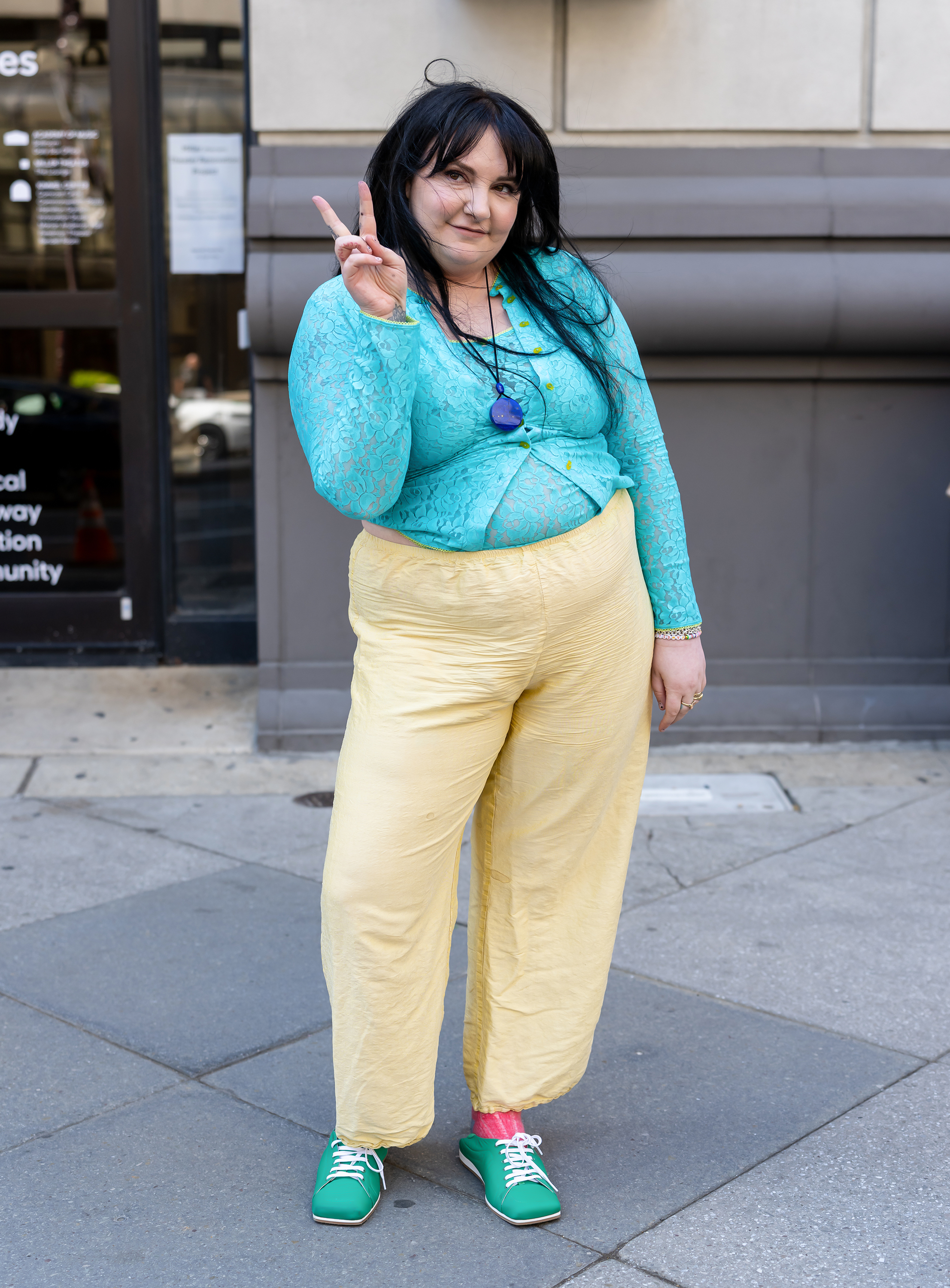 Lena Dunham wore butter yellow with aquamarine teal on her book tour
