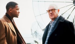 Enemy of the State a tense rooftop conversation between Will Smith and Gene Hackman