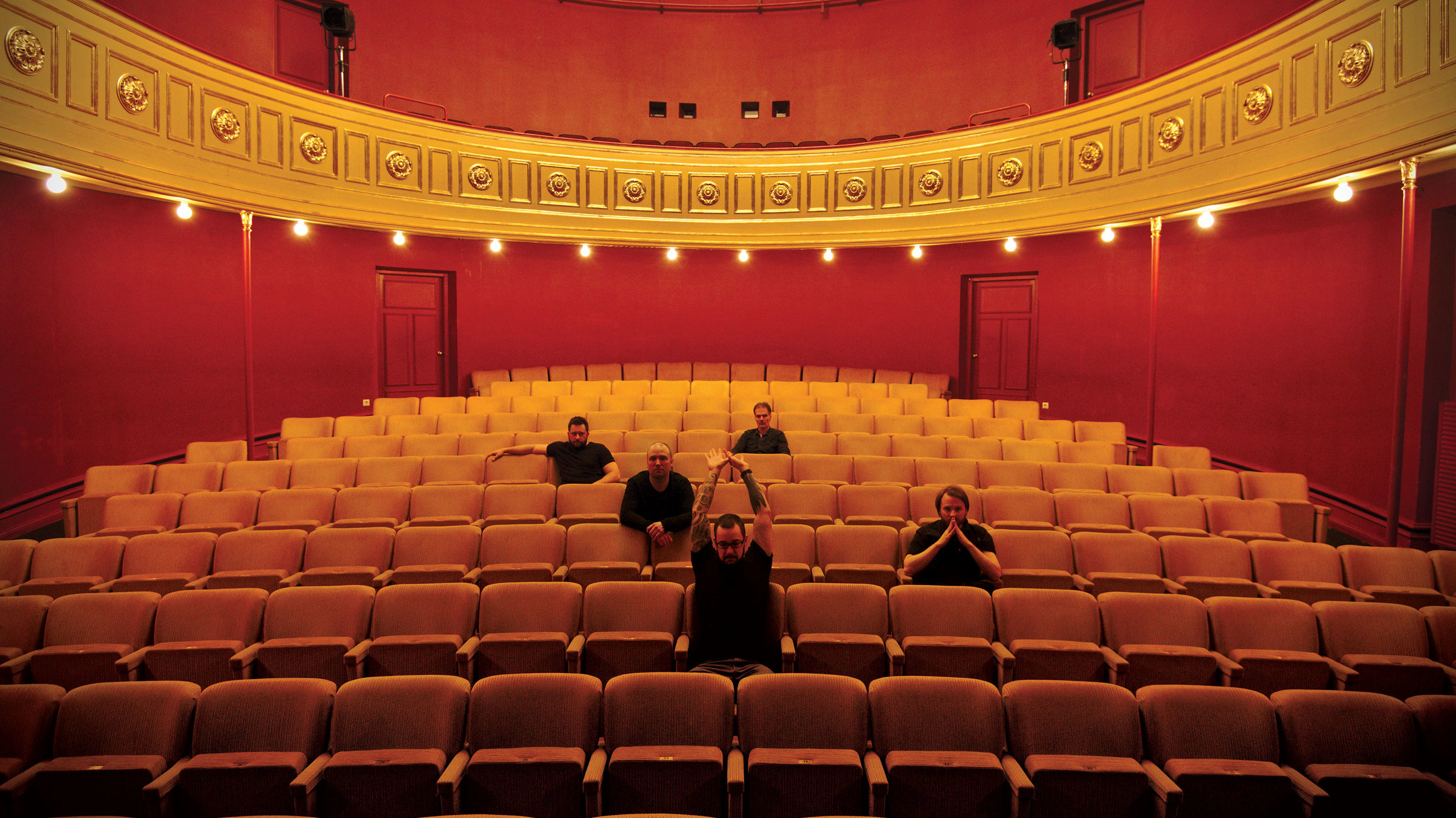 Wolverine in an empty red theatre