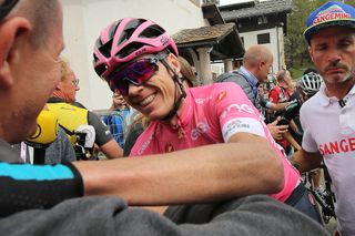 Chris Froome celebrates sealing the overall win after stage 20 at the Giro