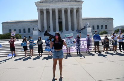 Activists in front of the Supreme Court building