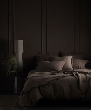 Abigail Ahern’s surprising colors that make a room look bigger, dark bedroom with brown paint and fabric
