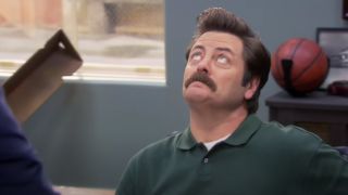 Nick Offerman as Ron Swanson, making sure his secret bacon is safe