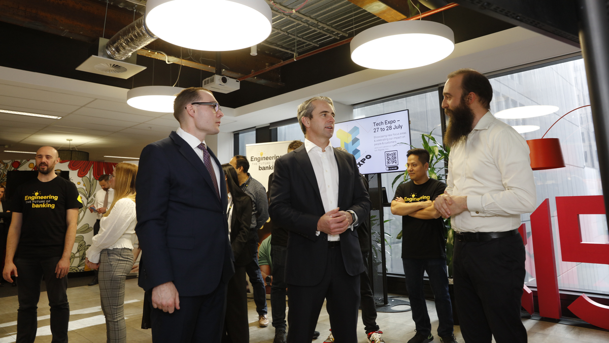 The opening of the new tech hub, with CBA employees talking to each other