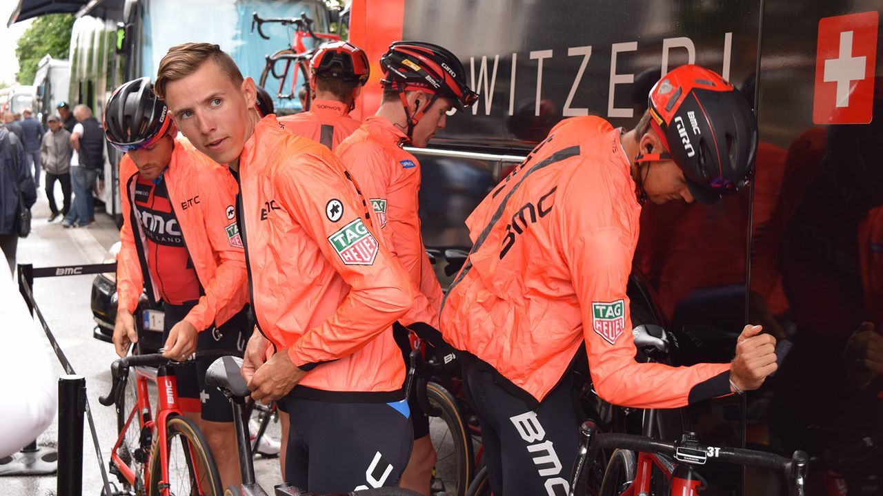 BMC Racing wore lightweight, orange rain jackets ahead of stage 1 from kit providers Assos