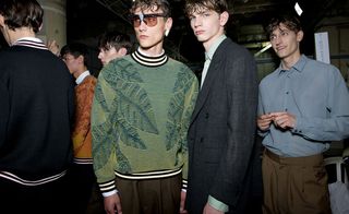 Males models wearing green, black, grey and blue shirts and jackets from the Cerruti 1881 SS2015 collection
