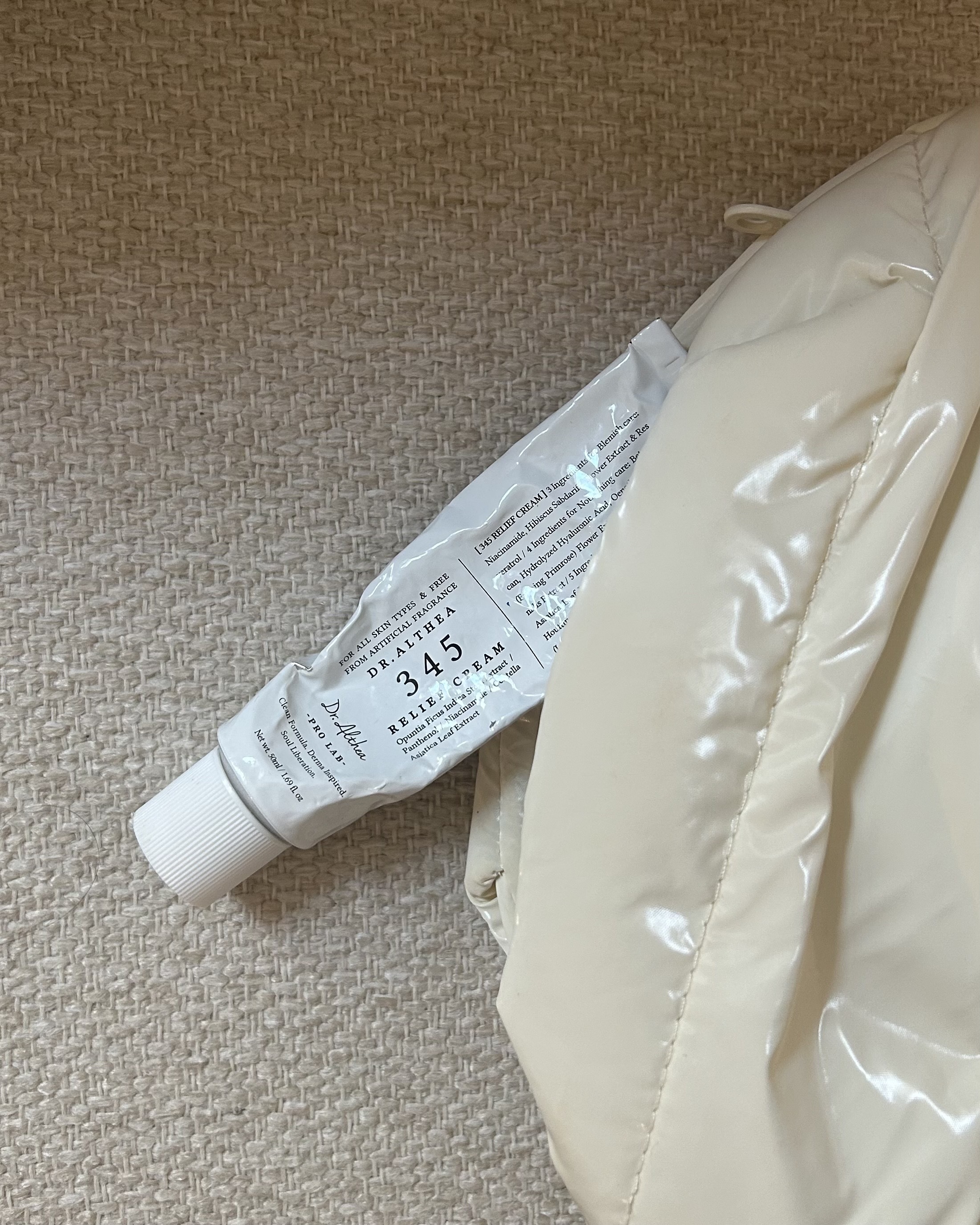 Dr. Althea's 345 Relief Cream peeking out of Alyssa Brascia's makeup bag.