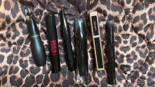 Beauty Editor Rhiannon Derbyshire's choice of the best Lancome Mascara buys on a leopard print background
