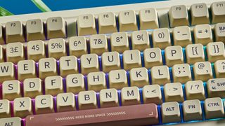 A beige, brown and off-white Epomaker RT100 wireless mechanical keyboard