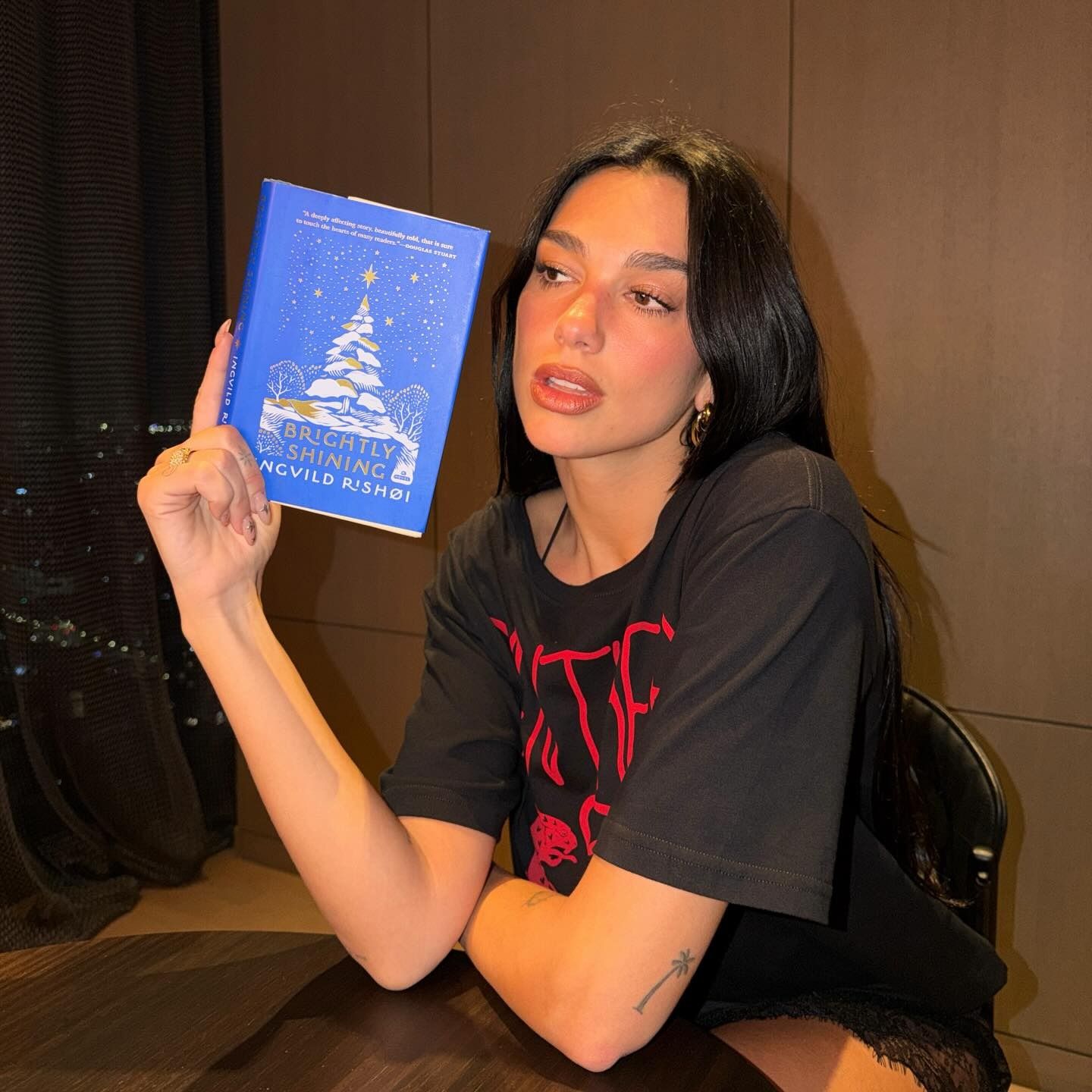 Dua Lipa with starry nails