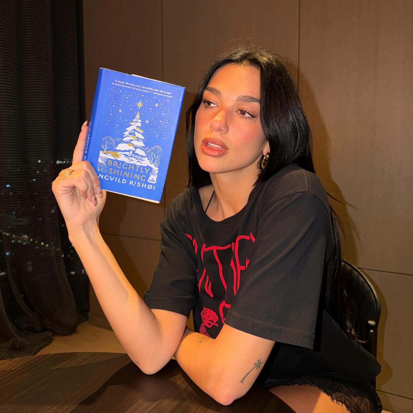 Dua Lipa with starry nails