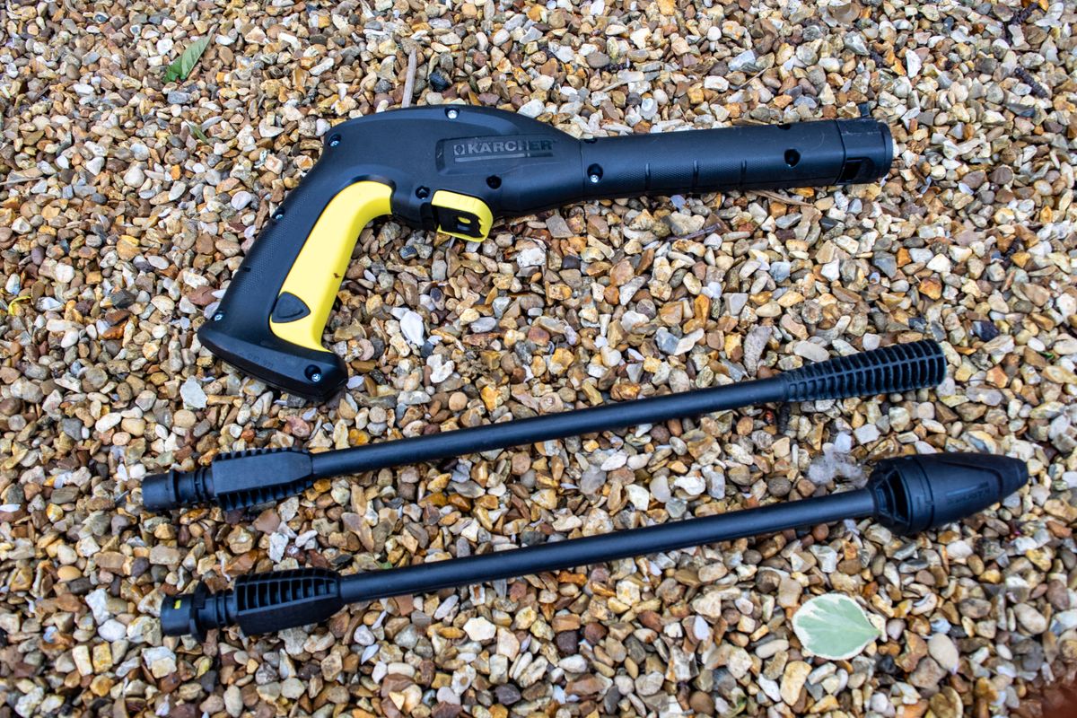 A Karcher K2 Pressure washer gun on some gravel