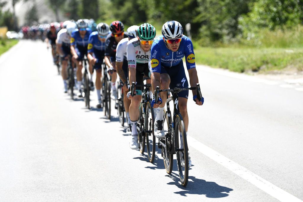 LEUKERBAD SWITZERLAND JUNE 10 lvaro Jos Hodeg Chagui of Colombia and Team Deceuninck QuickStep leads The Peloton during the 84th Tour de Suisse 2021 Stage 5 a 1752km stage from Gstaad to Leukerbad 1385m UCIworldtour tds tourdesuisse on June 10 2021 in Leukerbad Switzerland Photo by Tim de WaeleGetty Images