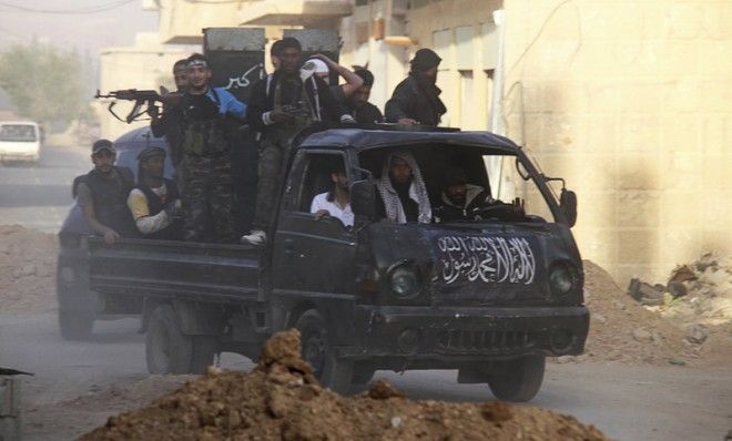 Free Syrian Army fighters head towards the frontline in Damascus on May 5. 